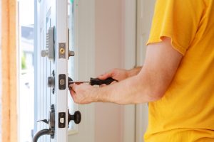 Professional locksmith installing a new door lock – Knoxmith Lock & Key Knoxville