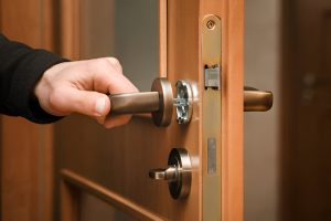 Locksmith fixing a residential door lock – Knoxmith Lock & Key